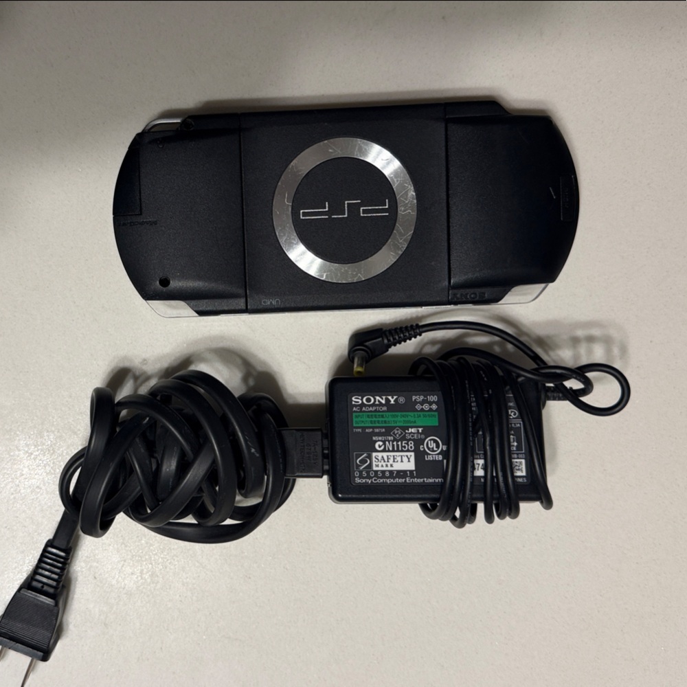 Sony PSP Slim Portable Gaming System in Black with Silver Ring